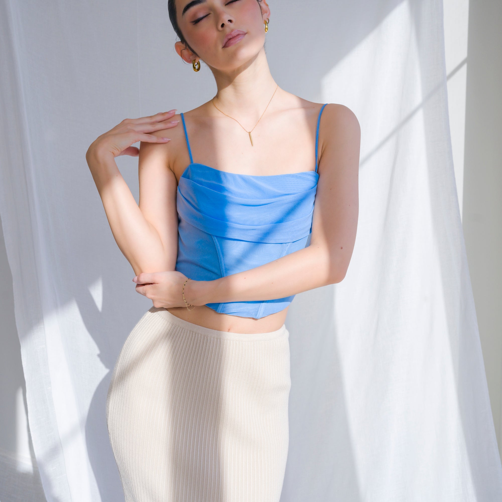 Cowl draped corset in nylon mesh