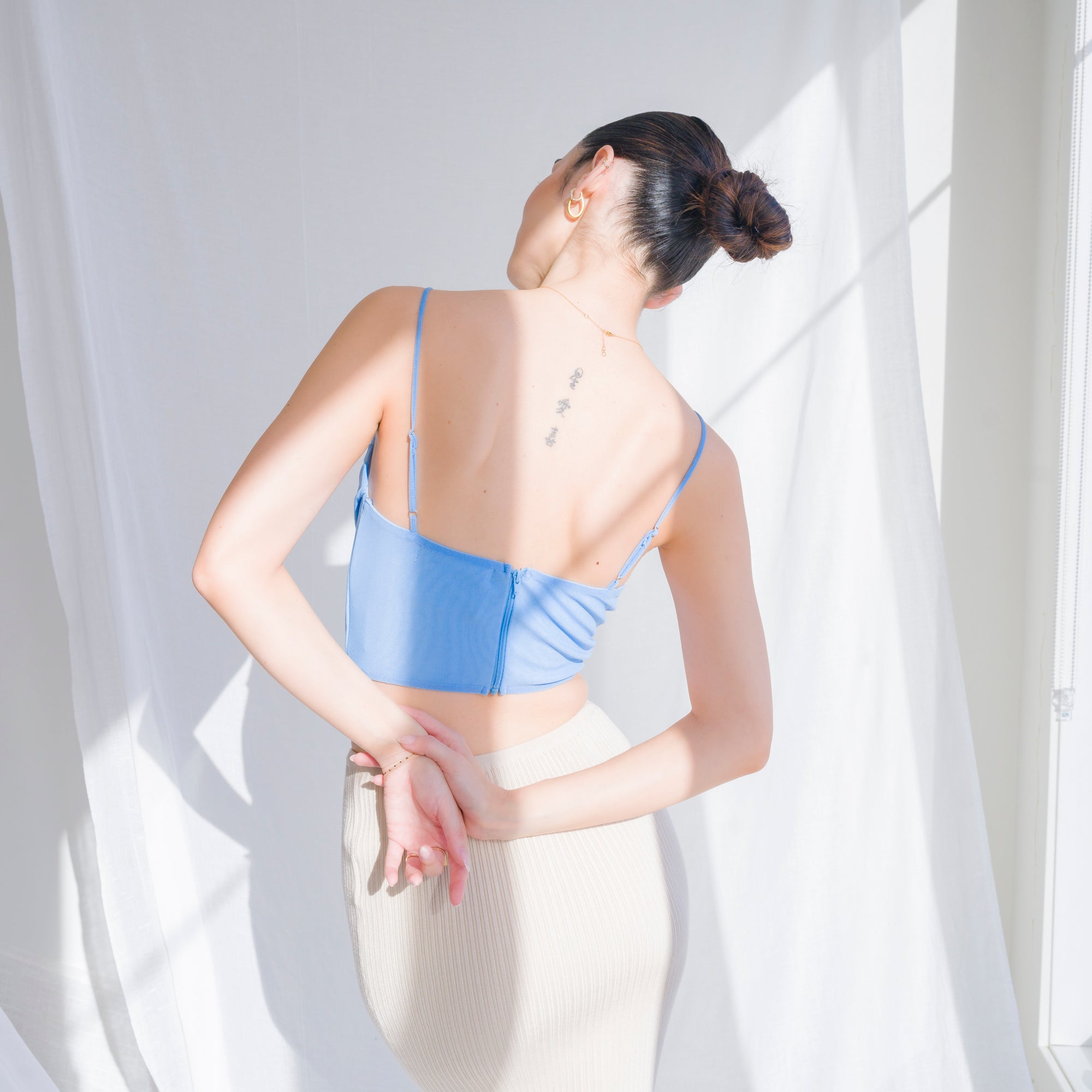 Cowl draped corset in nylon mesh
