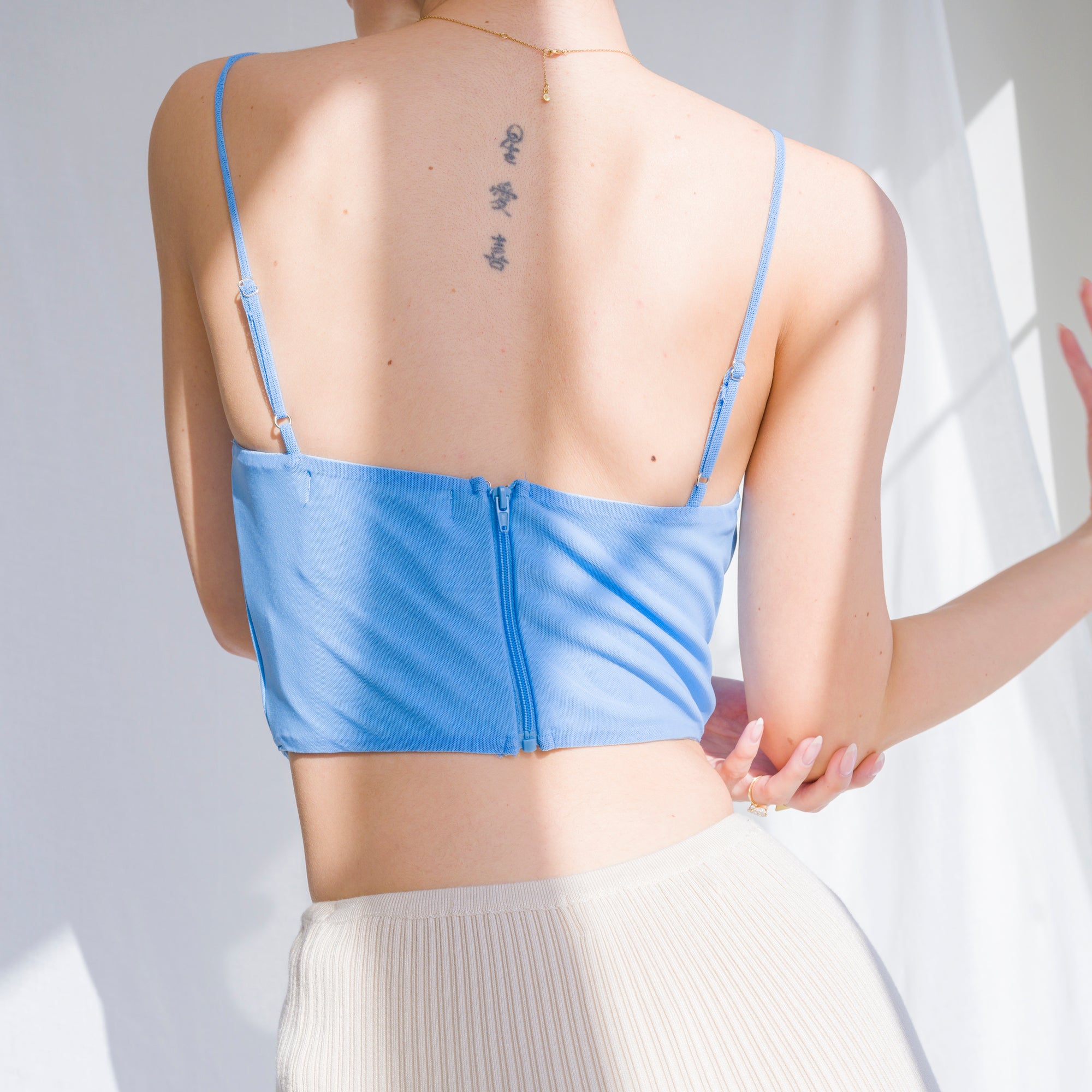 Cowl draped corset in nylon mesh