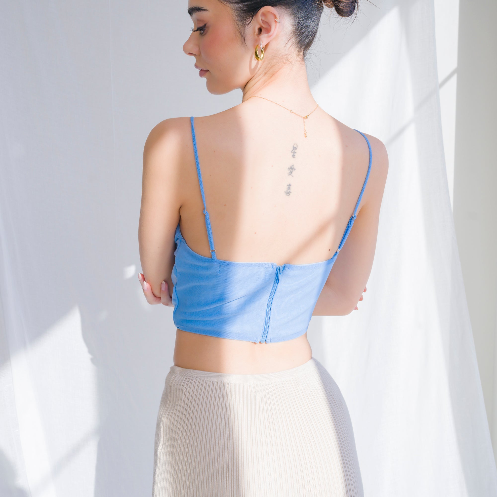 Cowl draped corset in nylon mesh