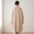OKAKIE beige heavy cotton blend knit coatigan with oversized lapel and drop shoulders, back view on a model.