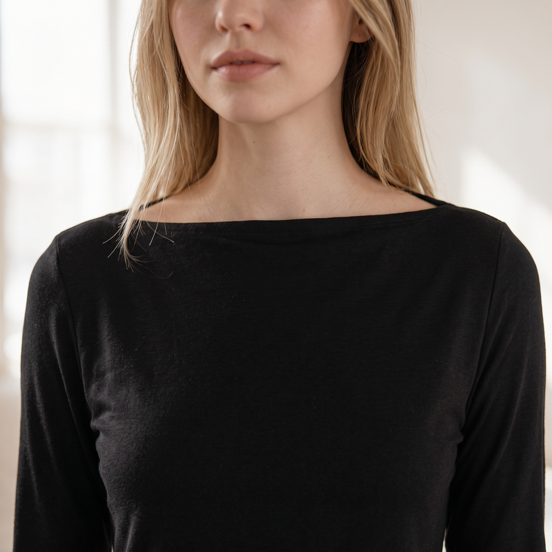 OKAKIE black long-sleeve top with a wide boat neckline in a soft brushed ribbed knit fabric on a model