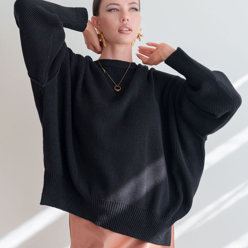 OKAKIE black heavyweight cotton boyfriend sweater with a crew neckline, dropped shoulders, and micro-ribbed texture.