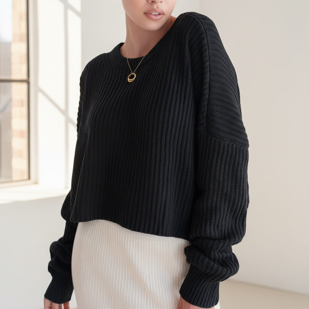 OKAKIE black oversized purl knit cropped sweater with drop shoulders and crew neckline worn by a model