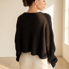 OKAKIE black oversized purl knit cropped sweater with drop shoulders and crew neckline worn by a model