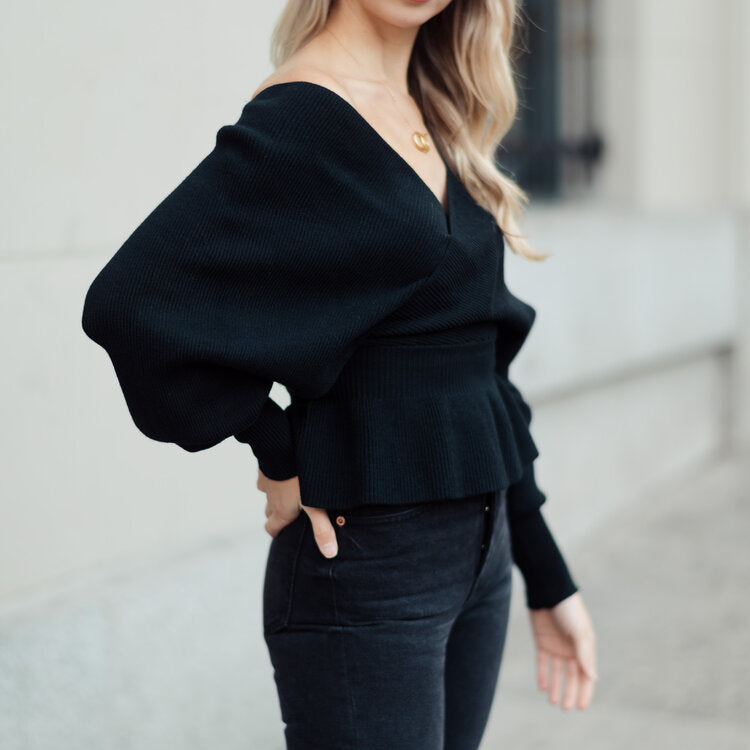 OKAKIE black ribbed knit wrap sweater featuring a deep V-neck, balloon sleeves, and a flattering peplum waist.