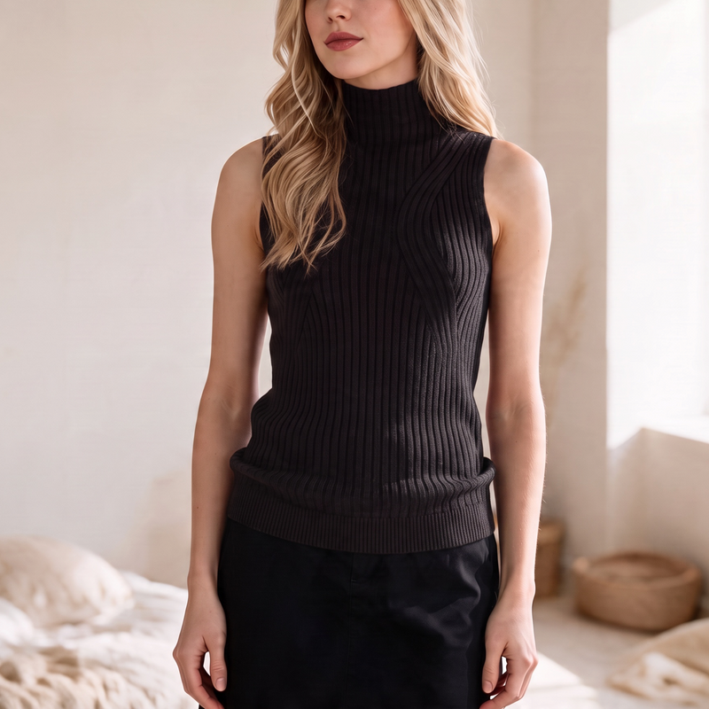Model wearing an OKAKIE black sleeveless high neck rib sweater top made from a soft viscose blend