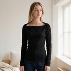 OKAKIE black long-sleeve rib knit top with a square neckline worn by a blonde model in a bright room.