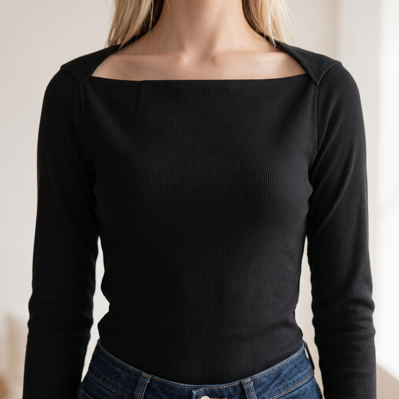 OKAKIE black long-sleeve rib knit top with a square neckline and fitted silhouette worn with blue denim jeans.