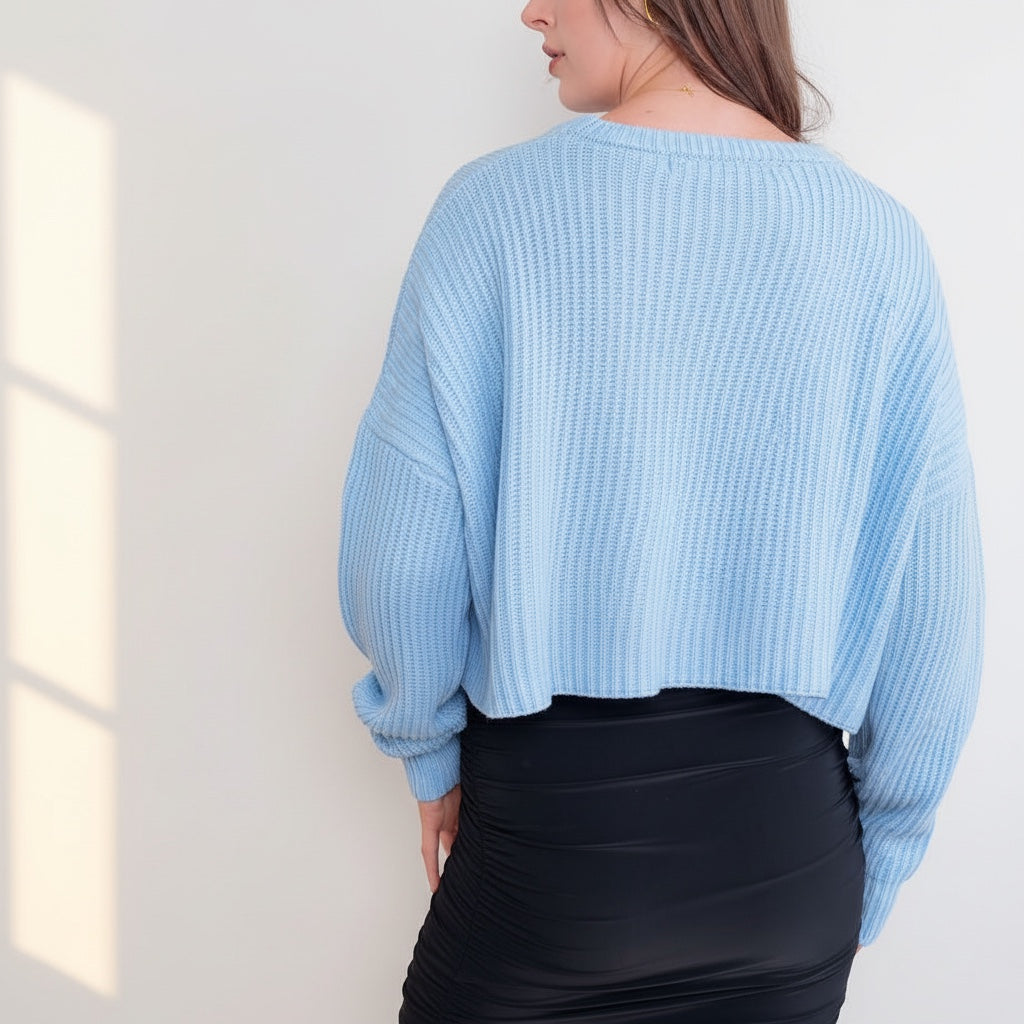 OKAKIE light blue oversized purl knit cropped sweater with drop shoulders and crew neck worn by a model