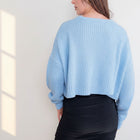 OKAKIE light blue oversized purl knit cropped sweater with drop shoulders and crew neck worn by a model