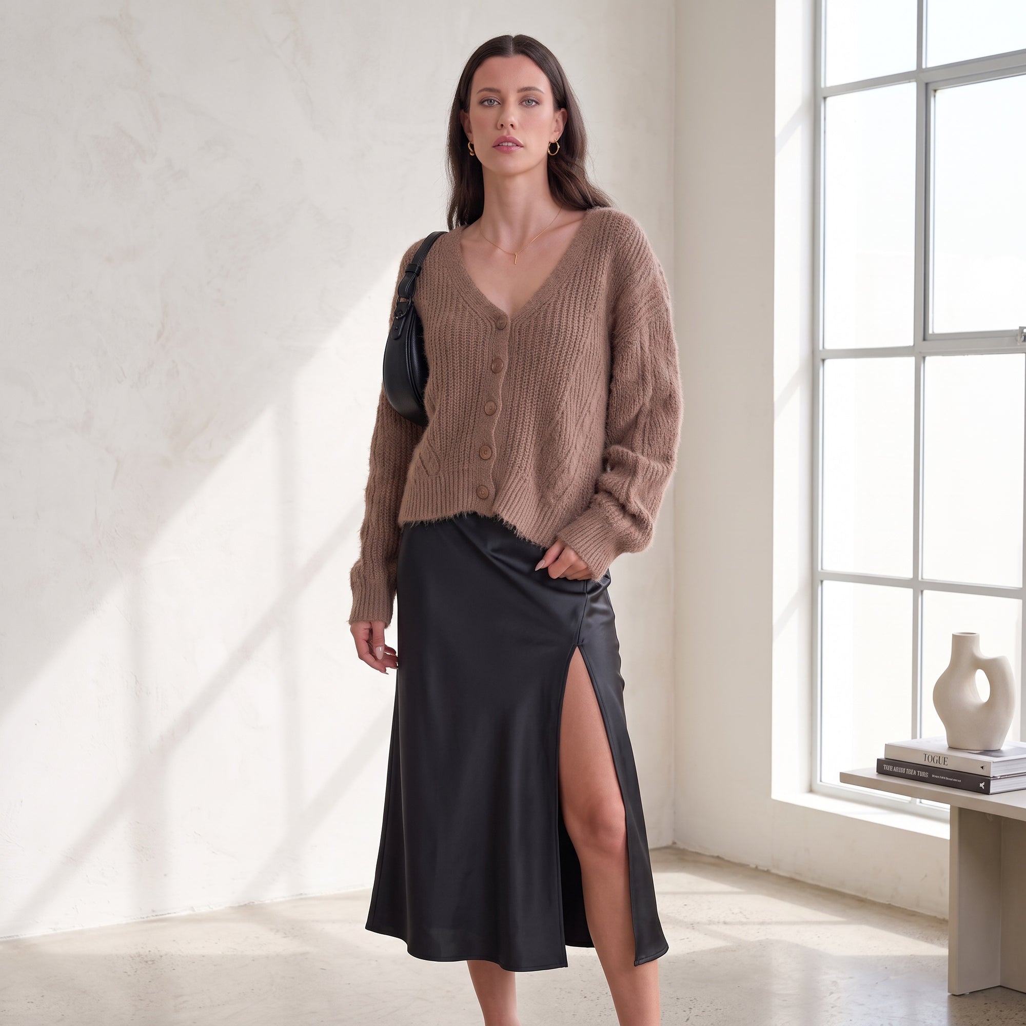 Model wearing an OKAKIE brown fuzzy V-neck button-up cardigan with ribbed texture and long sleeves paired with a skirt