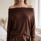 OKAKIE Maëlle draped hacci knit top in dark brown with a wide boat neckline worn off the shoulder.