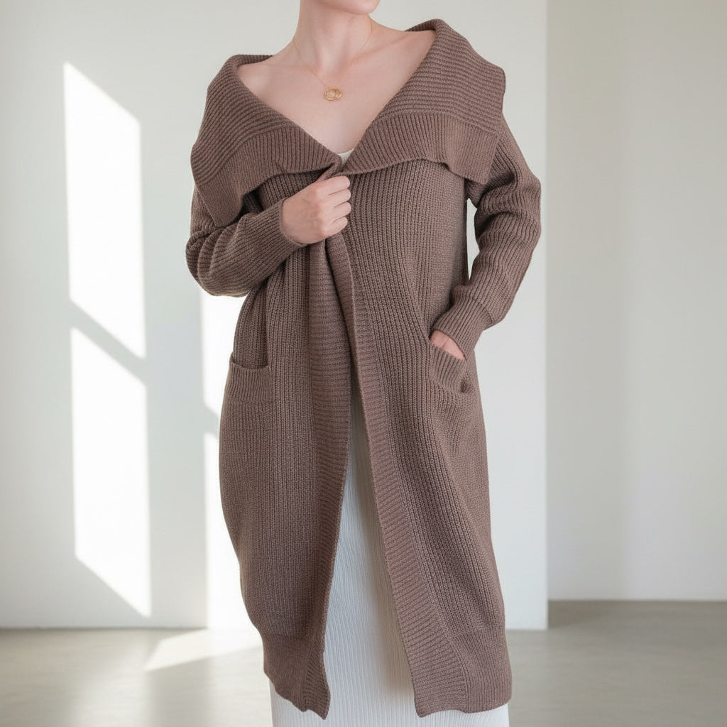 OKAKIE brown oversized purl knit coatigan with wide lapels, drop shoulders, and patch pockets on a model.