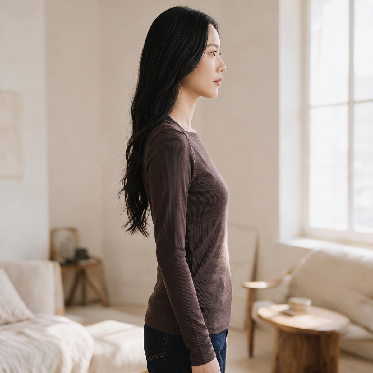 OKAKIE brown long-sleeve square neck rib knit top worn by a woman in a minimalist sunlit room