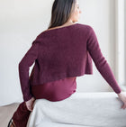 OKAKIE burgundy fuzzy knit bolero cardigan worn by a woman, showing the soft textured long-sleeve cropped silhouette.
