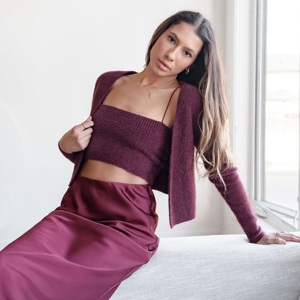 OKAKIE burgundy fuzzy knit tank and bolero set worn by a woman with long hair sitting near a window