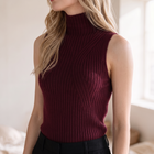 OKAKIE burgundy sleeveless high neck rib knit top with sculpted curved detailing on a model