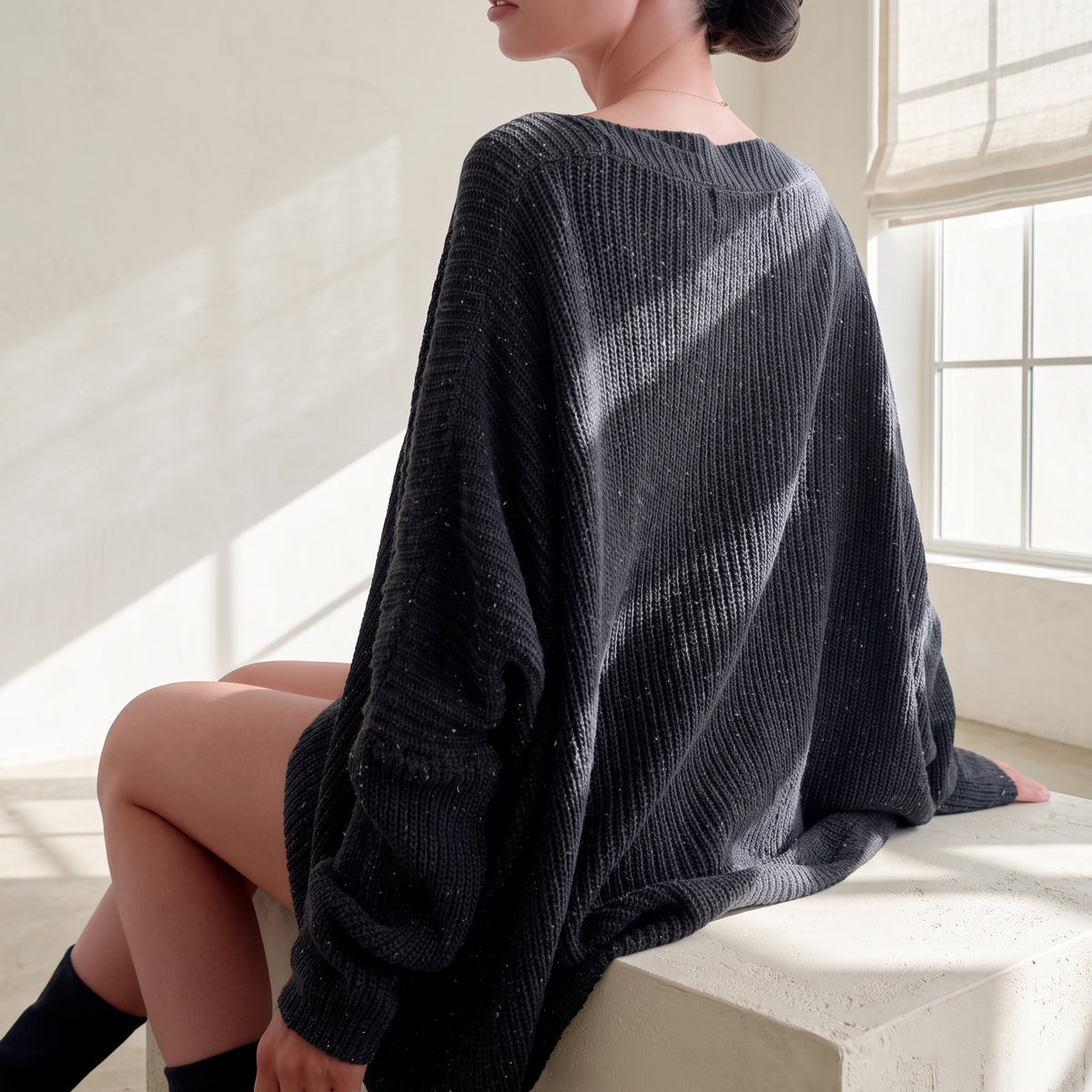 OKAKIE heavy cotton tunic in charcoal with a purl knitted texture, wide V-neck, and loose drop-shoulder fit.