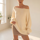 OKAKIE cream heavy ribbed knit sweater with a boat neckline and drop shoulder sleeves in an oversized tunic length.