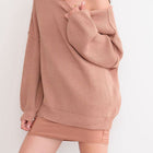 OKAKIE oversized cream ribbed knit tunic sweater with dropped shoulders and a wide neckline worn off the shoulder