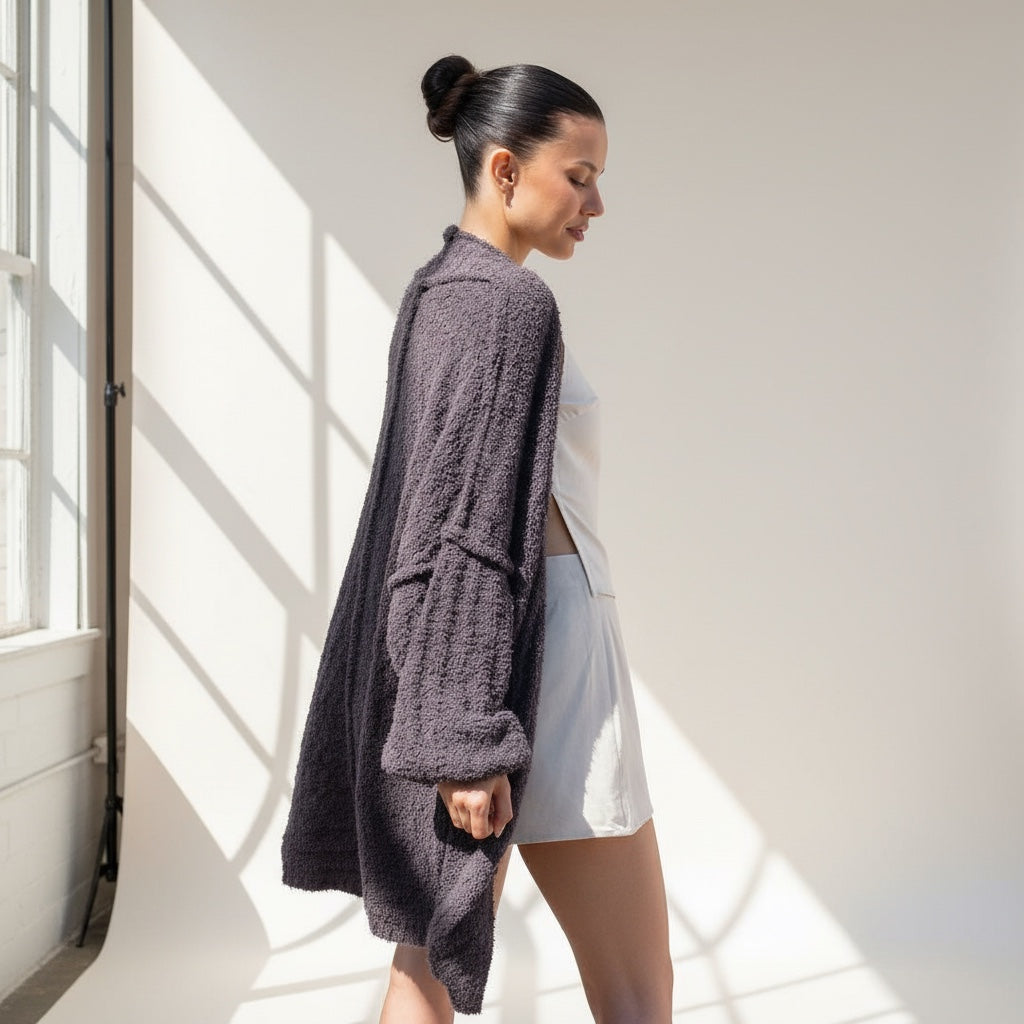 Model wearing an OKAKIE dark purple-grey plush teddy cocoon cardigan with drop shoulders in an oversized fit.