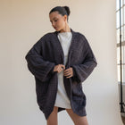 OKAKIE dark purple-grey teddy cocoon cardigan with high-pile texture, drop shoulders, and oversized fit on a model.