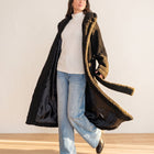 OKAKIE black plush teddy maxi robe coat with shawl collar and waist belt worn over a white top and blue jeans