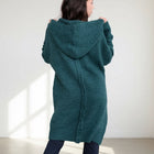 OKAKIE knee-length fuzzy hooded cardigan in deep teal with a center back seam and oversized fit