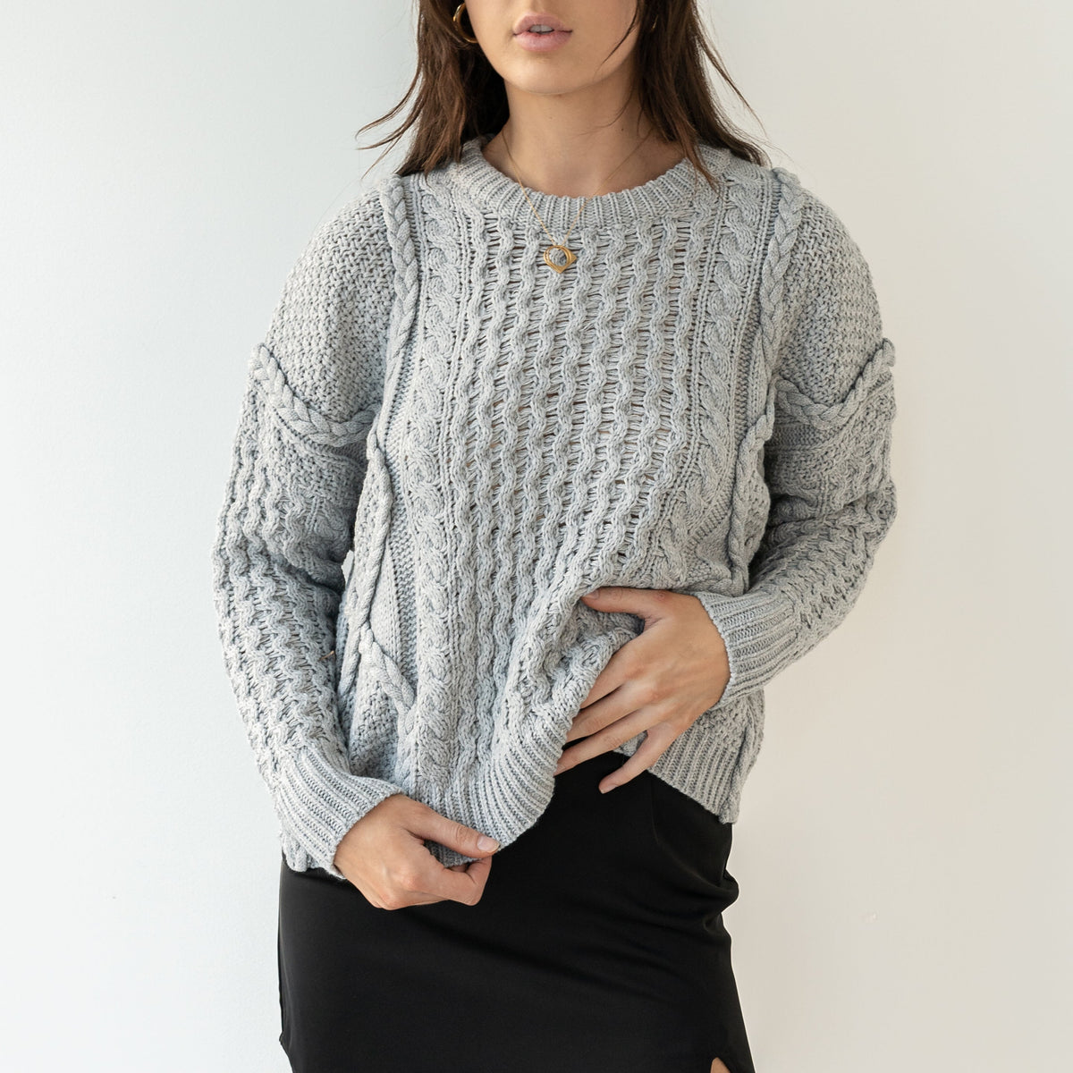OKAKIE grey 100% cotton cable knit sweater with intricate textured patterns, crew neck, and oversized silhouette.