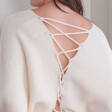 OKAKIE ivory knit sweater featuring a feminine adjustable lace-up back detail and soft textured fabric