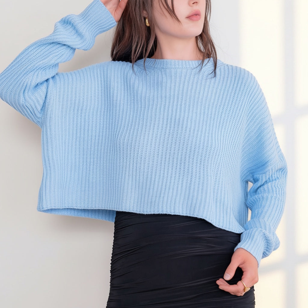 OKAKIE light blue oversized cropped sweater with purl knit texture, crew neckline, and drop shoulder sleeves.