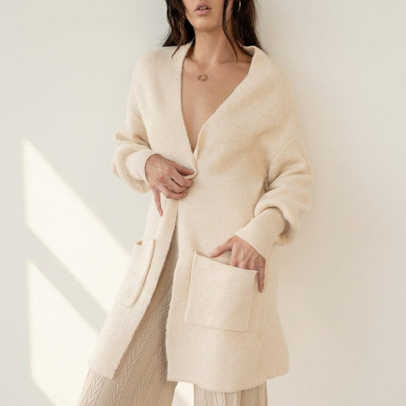 OKAKIE Marcelle heavy knit coatigan in cream with an open front, shawl collar, and oversized patch pockets.