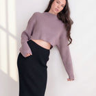 OKAKIE mauve cropped heavy ribbed knit sweater with drop shoulders and high neckline worn with a black ribbed skirt