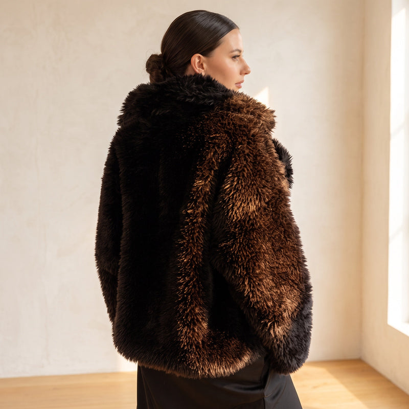 OKAKIE Noire plush faux fur coat in dark brown with a voluminous shawl collar and relaxed hip-length fit.