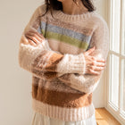 OKAKIE pastel striped sweater with a plush high-pile texture, crew neckline, and drop shoulders in a loose fit.