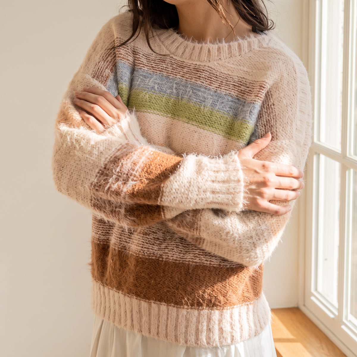 OKAKIE pastel striped sweater with a plush high-pile texture, crew neckline, and drop shoulders in a loose fit.