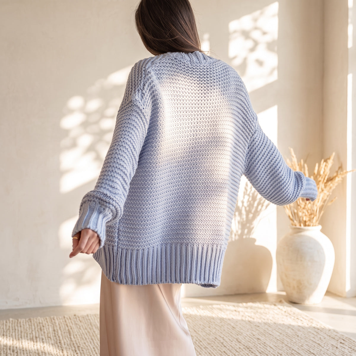 OKAKIE periwinkle heavy knit oversized cardigan with dolman sleeves and purl texture worn by a model