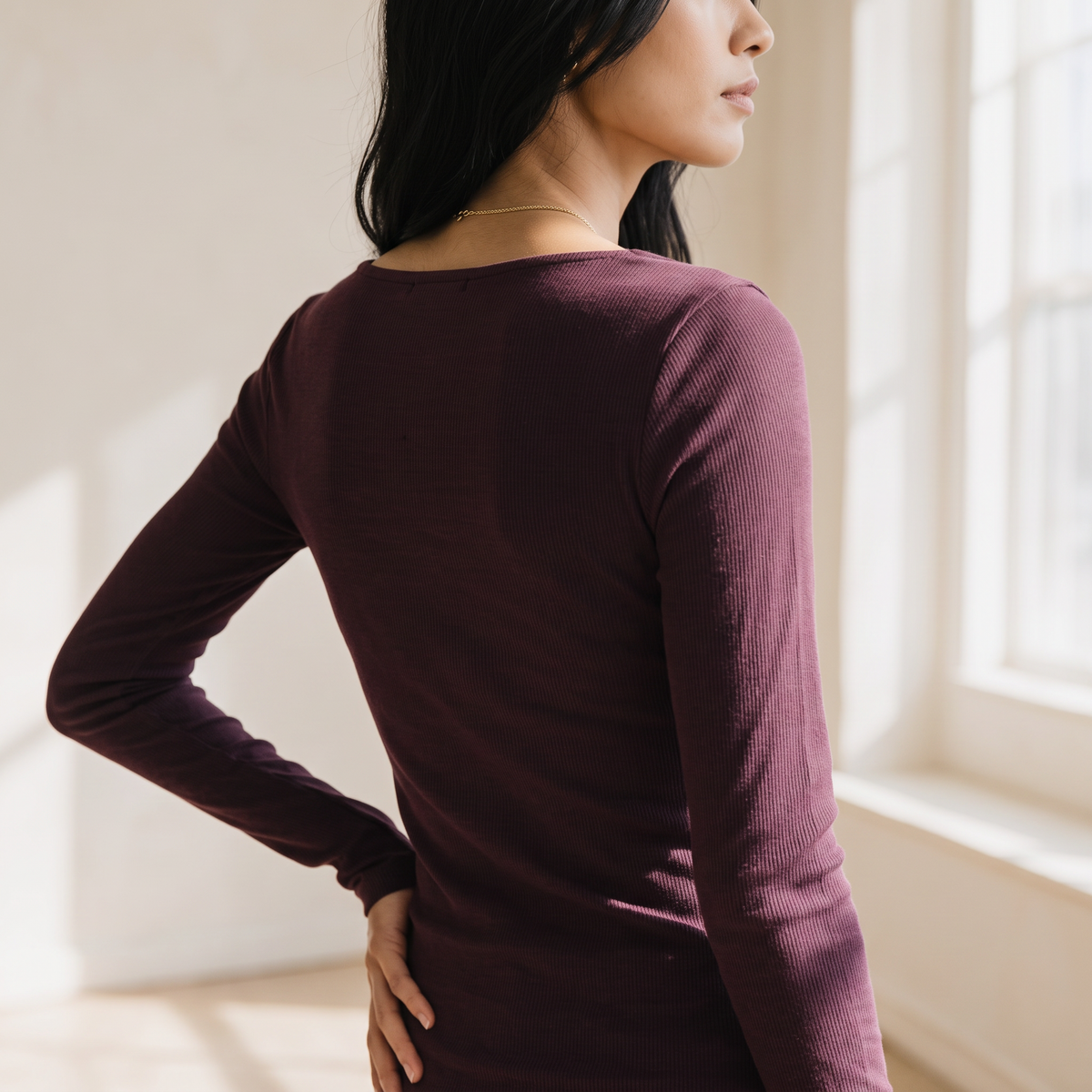 OKAKIE long sleeve rib knit top in deep plum featuring a fitted silhouette and back view on a model