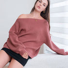 OKAKIE oversized dusty rose ribbed knit tunic sweater with dropped shoulders worn off the shoulder by a model