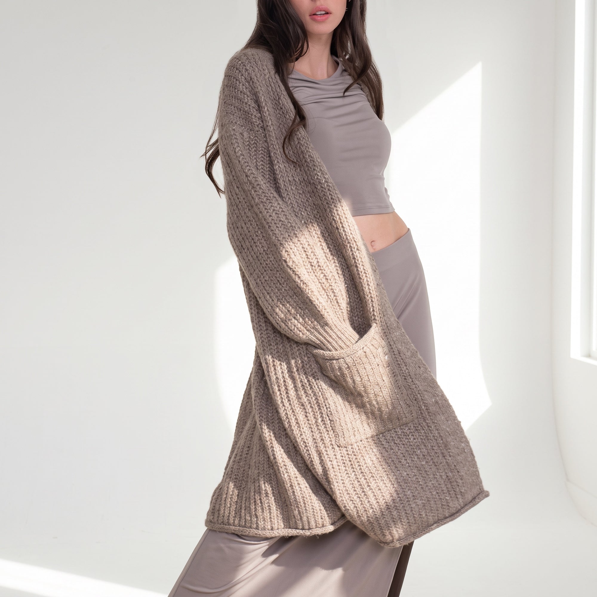 OKAKIE heavy warm taupe purl knit cardigan with deep pockets worn over a matching fitted top and skirt
