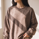OKAKIE oversized fleece pullover in a vintage-inspired brown acid-wash finish with balloon sleeves and ribbed trim.