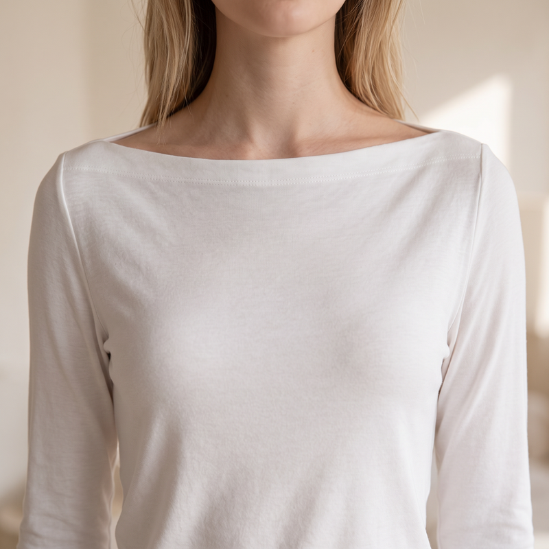 OKAKIE white long-sleeve top with a wide boat neckline in a soft brushed knit fabric for a relaxed feminine fit.