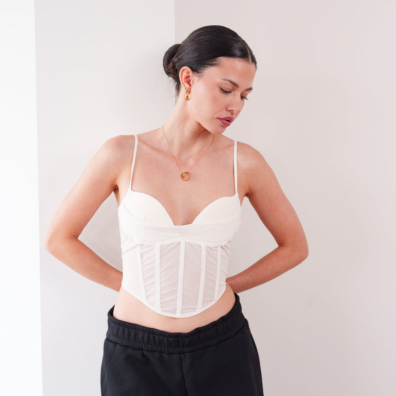 OKAKIE white mesh bustier with padded bodice and adjustable straps worn by a woman against a neutral background