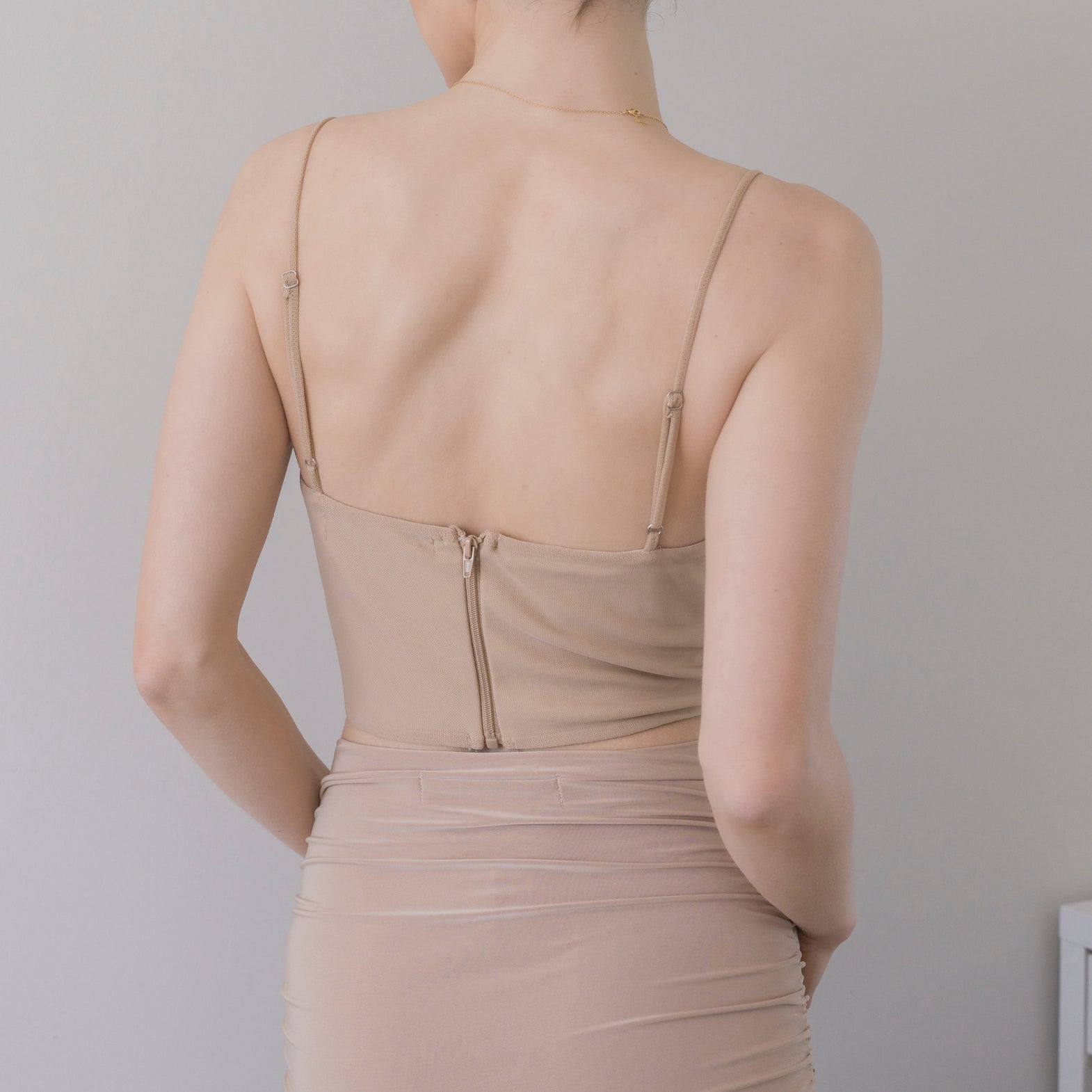 Cowl draped corset in nylon mesh
